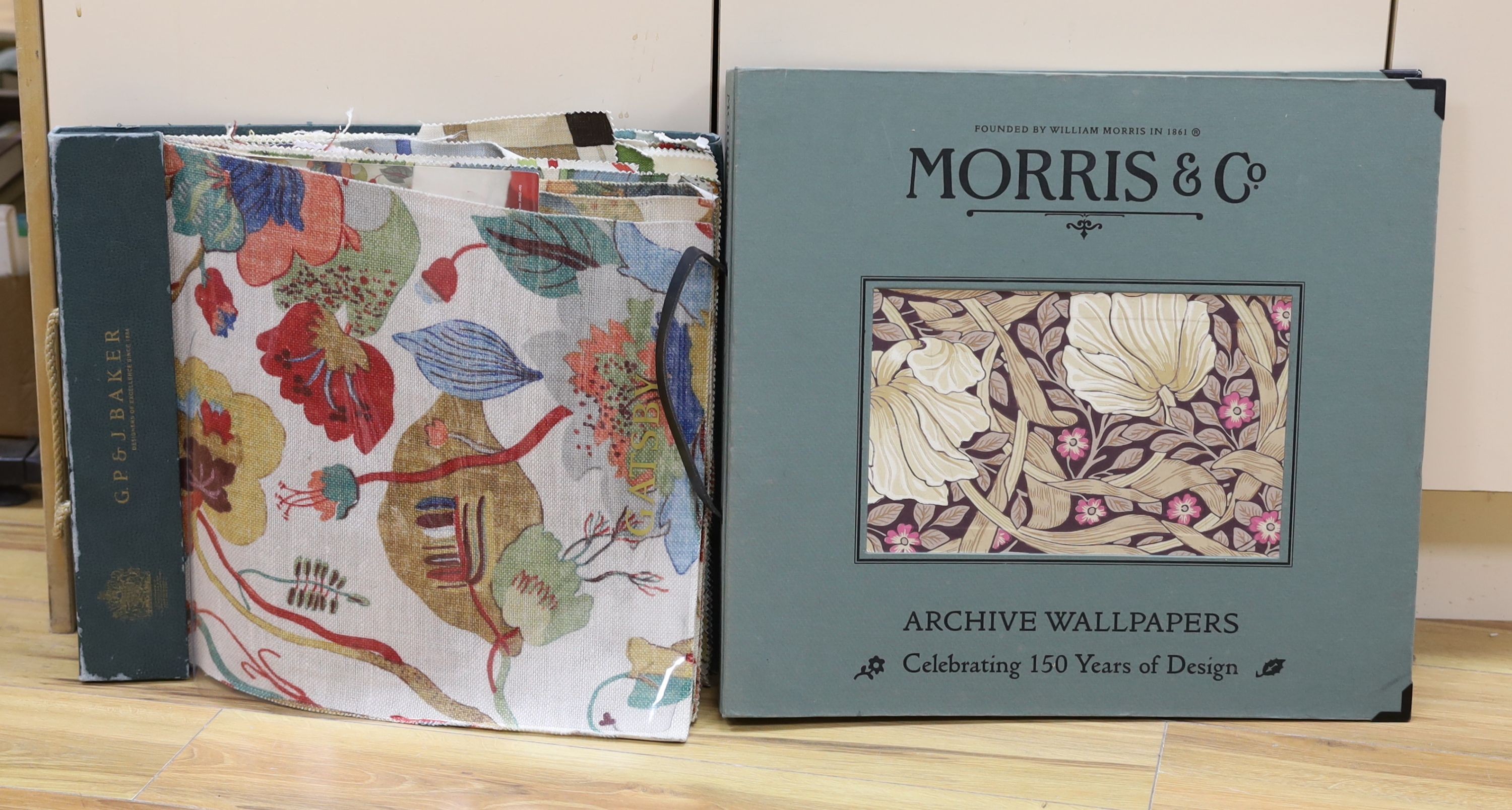 A contemporary William Morris & Co. archive wallpaper pattern book celebrating 150 years of Morris and Co. Design, together with G.P. & J Baker linen pattern book (2)